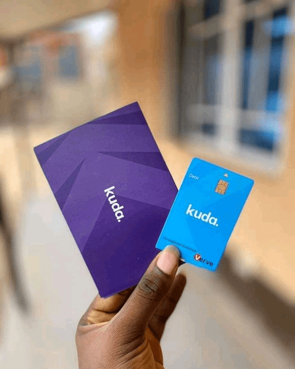 A Kuda debit card and its purple delivery packaging